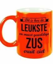 Leukste en meest geweldige zus cadeau mok beker neon oranje 330 ml